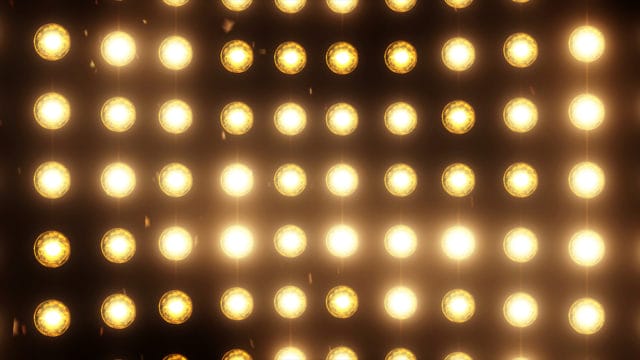 พื้นหลังไฟน้ําท่วมสว่างพร้อมอนุภาคและเรืองแสง สีทอง มีตัวเลือกสีเพิ่มเติมในพอร์ตโฟลิโอของฉัน